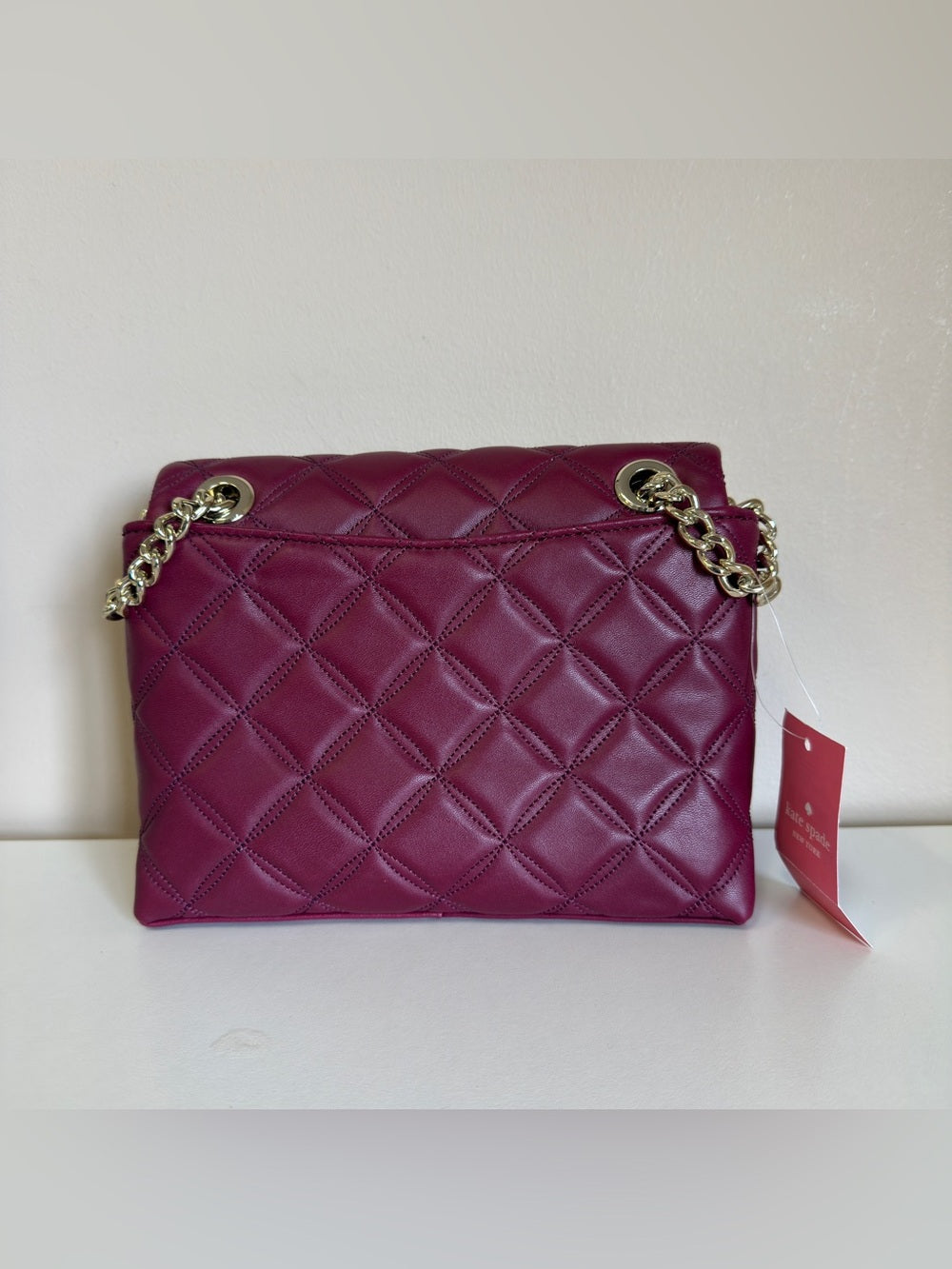 Kate Spade quilted shoulder bag in deep berry detail