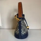 Tory Burch blue and brown mini bucket bag detail