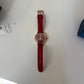 Swarovski red and gold watch detail