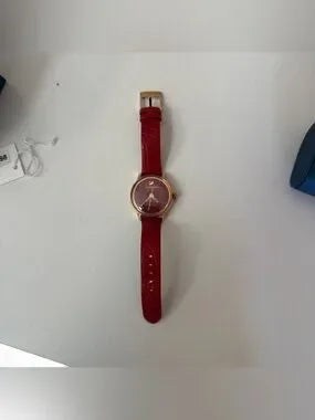 Swarovski red and gold watch detail