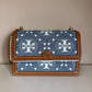 Tory Burch T Monogram denim shoulder bag in blue and brown detail