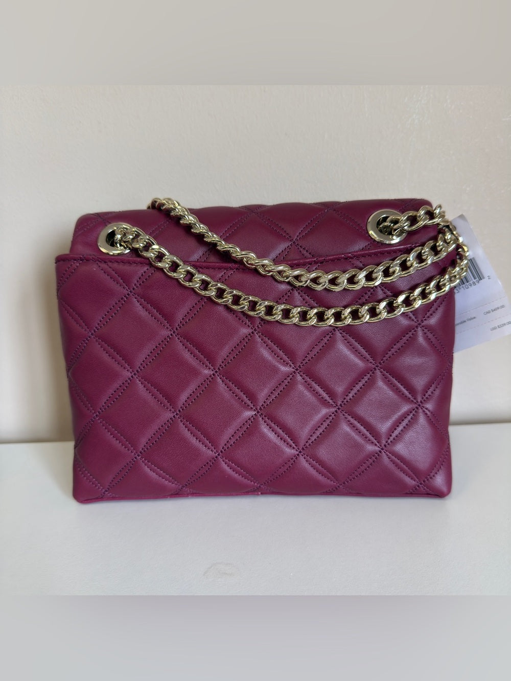 Kate Spade quilted shoulder bag in deep berry detail