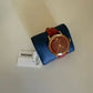 Swarovski red and gold watch detail