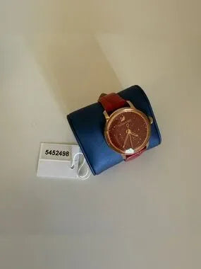 Swarovski red and gold watch detail