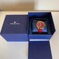 Swarovski red and gold watch detail