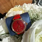 Swarovski red and gold watch detail