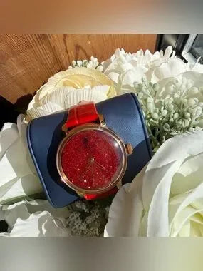 Swarovski red and gold watch detail