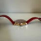 Swarovski red and gold watch detail