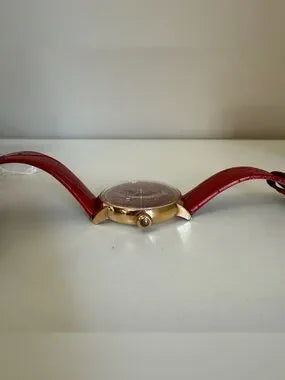 Swarovski red and gold watch detail