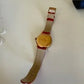 Swarovski red and gold watch detail
