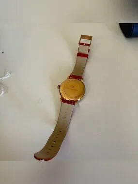 Swarovski red and gold watch detail