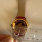 Swarovski red and gold watch detail