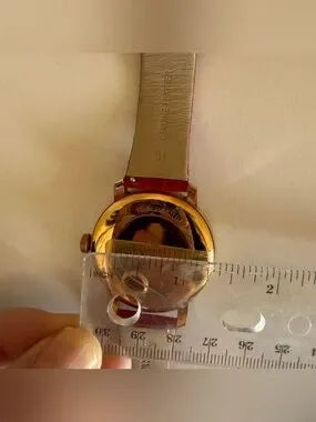 Swarovski red and gold watch detail