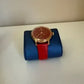 Swarovski red and gold watch detail