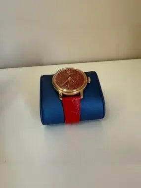Swarovski red and gold watch detail