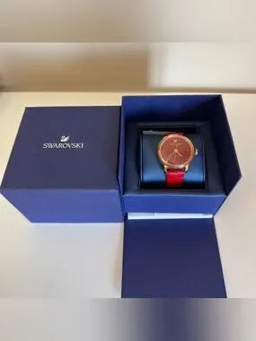 Swarovski red and gold watch detail