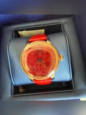 Swarovski red and gold watch detail