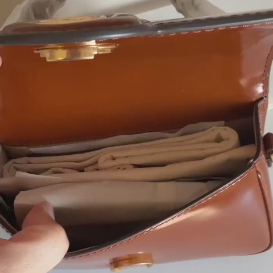 Tory Burch Robinson small brown top handle bag product video